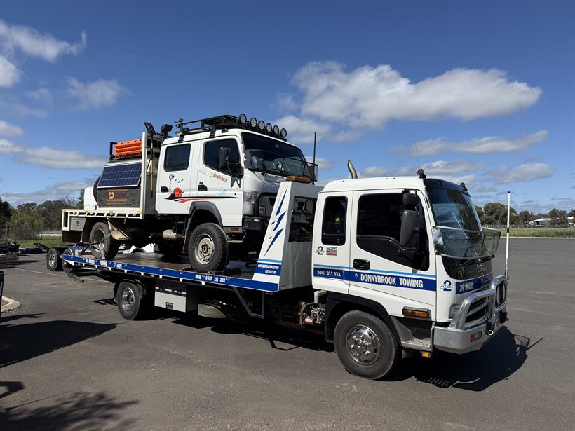 Kitted-out 4x4 expedition truck carried on the tilt tray